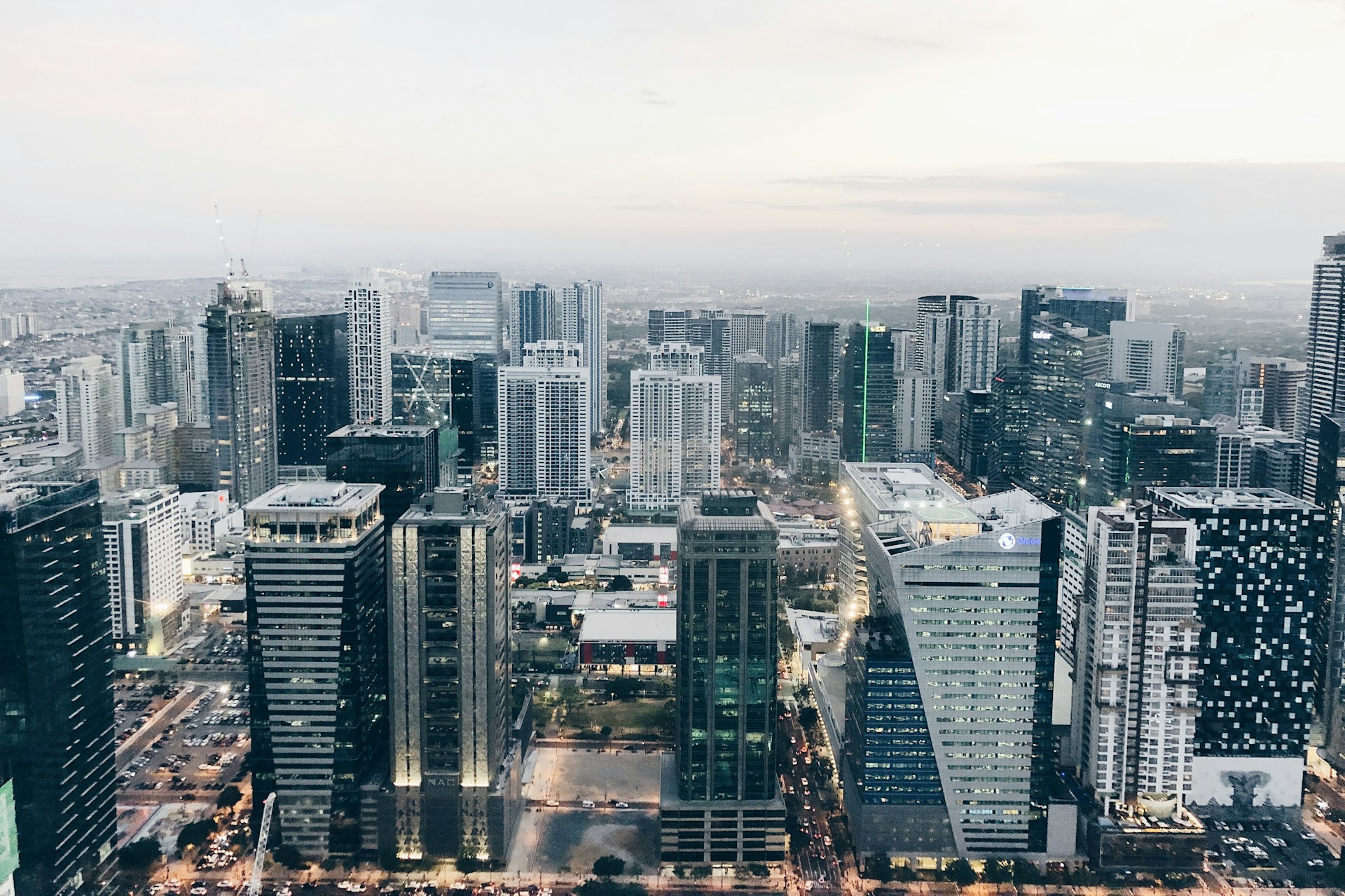 Manila skyline at sunset with Pasig River and city lights