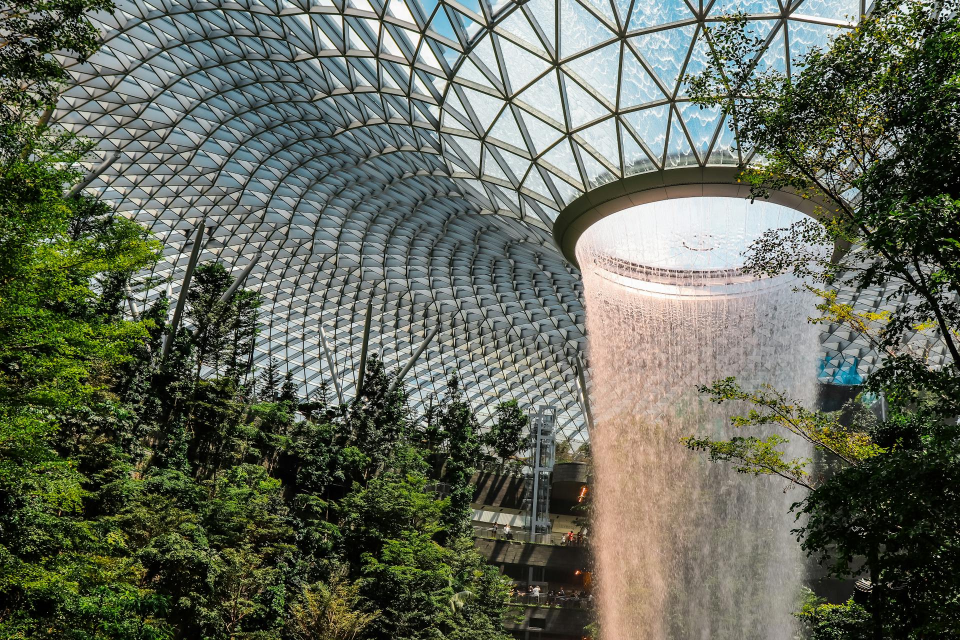 Singapore's Rain Vortex at Changi Airport - modern architecture with indoor waterfall